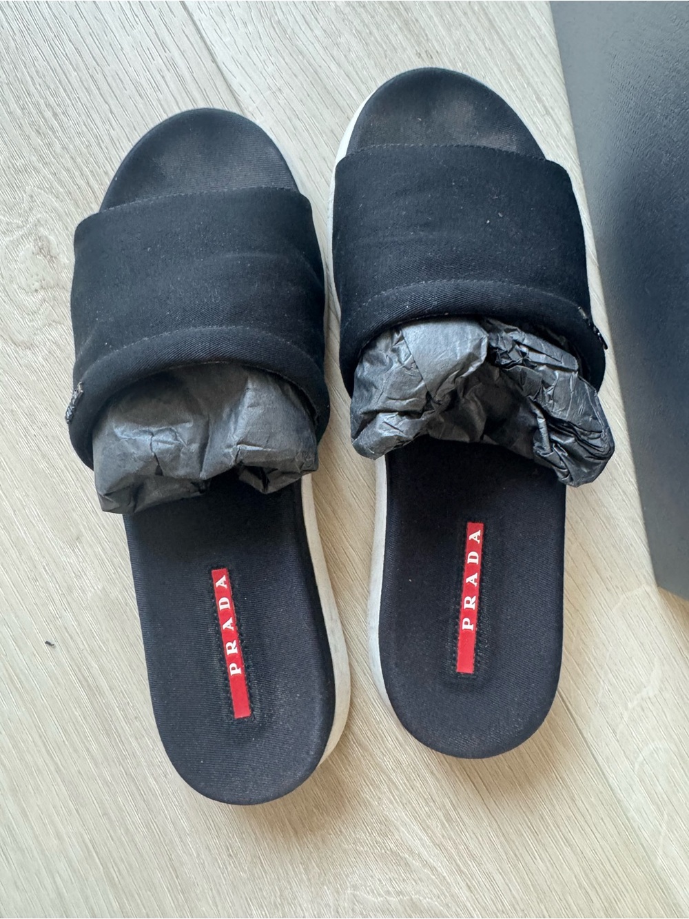 Prada Black Slides with Red Logo Stripe